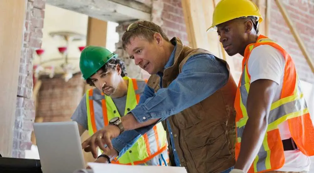 Trades Website Cost - Tradesmen with a Laptop - Web Design and SEO Company Limited