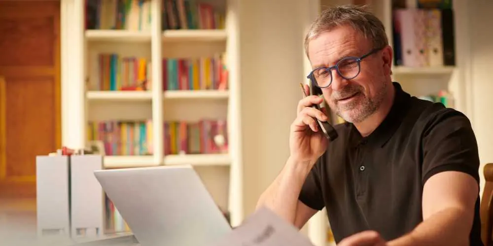 Hiring a Web Designer - Business Owner on Phone - Web Design and SEO Company Limited