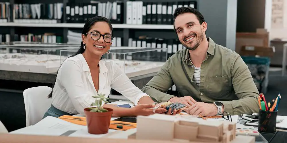 Logo for Small Business - Smiling Couple in Office Environment - Web Design and SEO Company Limited