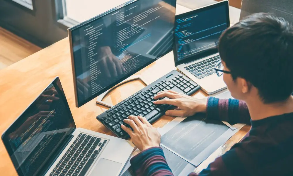 Website Developer UK - Web Developer Working on Computer - Web Design and SEO Company Limited