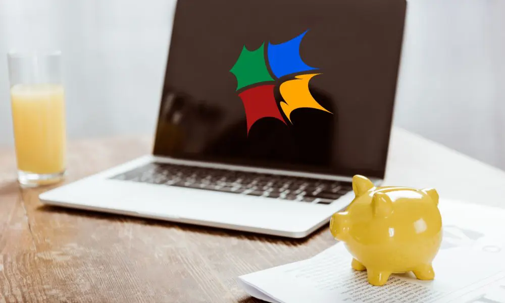 Website Design Pricing - Laptop with Logo and Yellow Piggy Bank - Web Design and SEO Company Limited