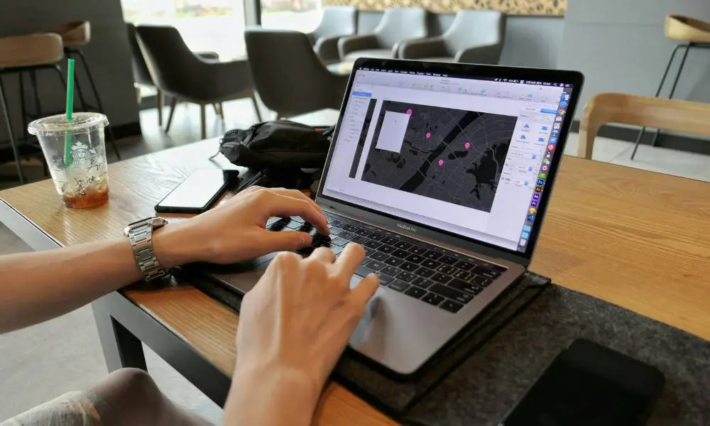 Small Business Websites 101 - Person Working on a Laptop - Web Design and SEO Company Limited