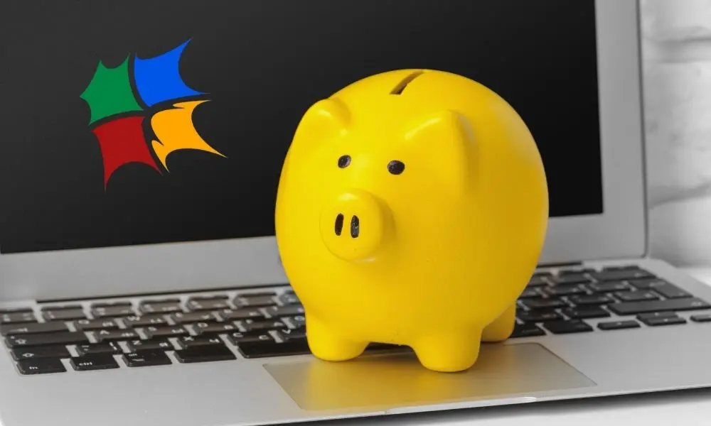 SEO Services Pricing - Piggy Bank on Laptop - Web Design and SEO Company Limited